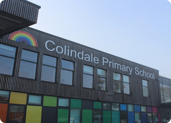 Colindale Primary School building signage with rainbow logo