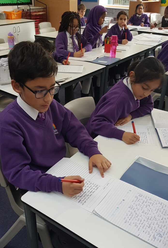 A class writing in their exercise books