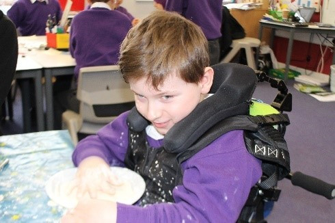 A pupil taking part in a practical classroom activity