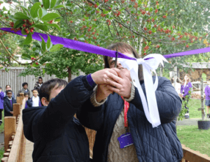 School council pupils cut the ribbon at the treehouse opening
